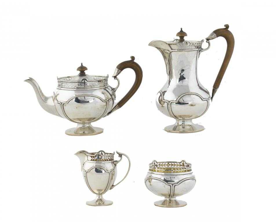 Appraisal: A GEORGE V FOUR PIECE TEA SERVICE with saw pierced