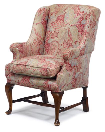 Appraisal: Queen Anne-style upholstered easy chair With straight cresting on shaped