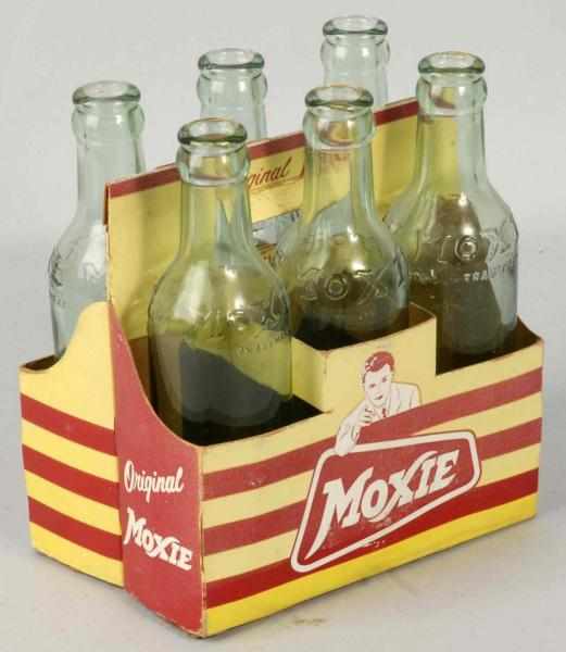 Appraisal: Moxie Soda Six-Pack with Bottles Original Caps Condition Excellent Size