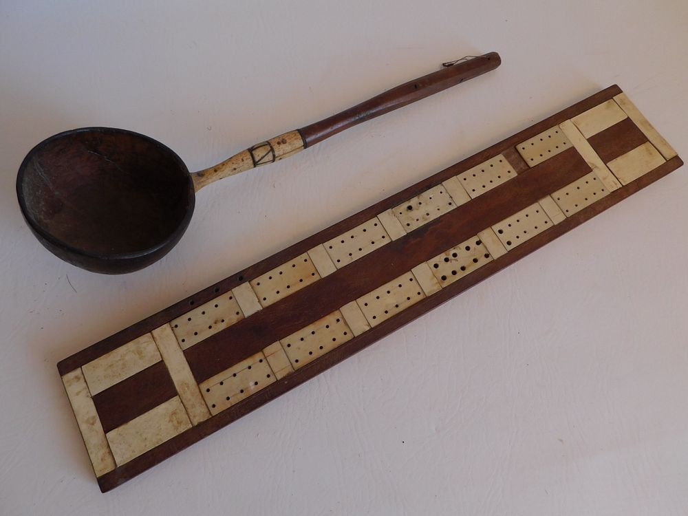 Appraisal: COCONUT DIPPER CRIBBAGE BOARD Antique bone and baleen inlaid coconut