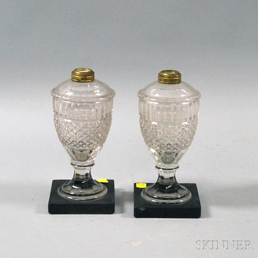 Appraisal: Pair of Pressed Glass Fluid Lamps th century urn-form lamps