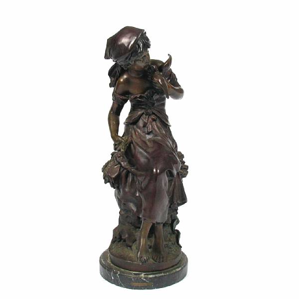 Appraisal: A patinated bronze figure of a young woman cast after