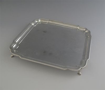 Appraisal: A modern square salver with incurved corners by Barker Bros