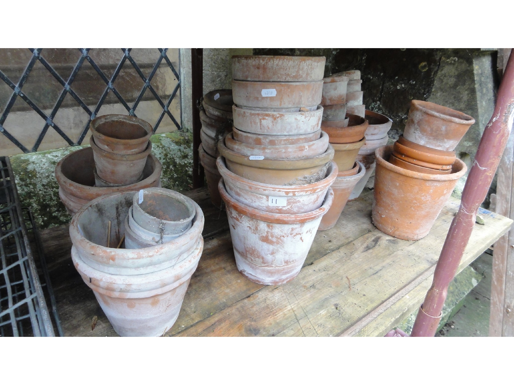 Appraisal: A quantity plus terracotta flower pots of varying size