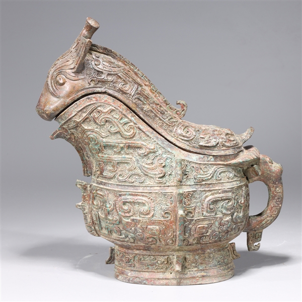 Appraisal: Chinese archaistic bronze covered vessel with intricately incised designs to