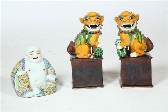 Appraisal: THREE CERAMIC FIGURES Asian th century Pair of pottery foo