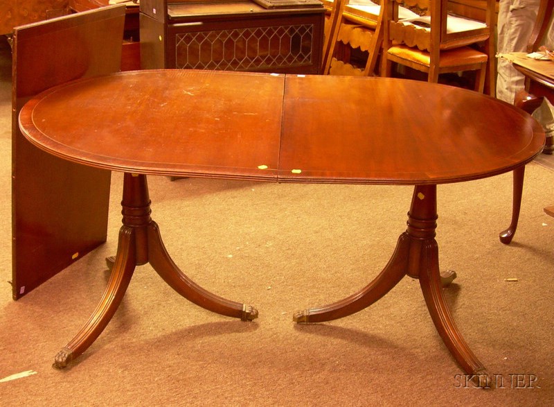 Appraisal: Georgian-style Mahogany and Mahogany Veneer Double-pedestal Dining Table with leaf