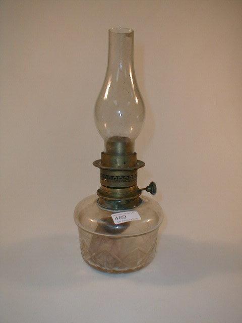 Appraisal: A paraffin lamp with chimney and glass base