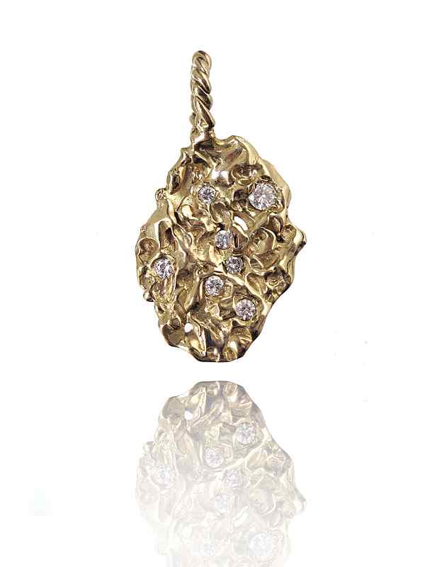 Appraisal: K DIAMOND NUGGET PENDANT K yellow gold nugget style pendant