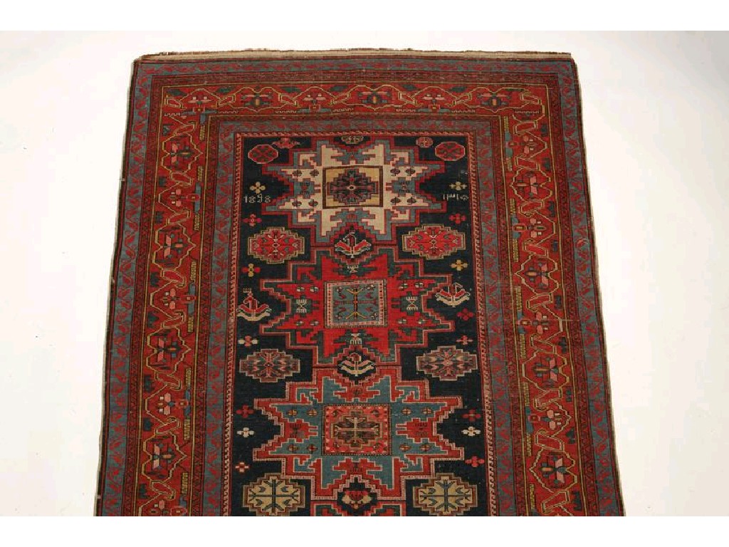 Appraisal: A NORTH WEST PERSIAN TRIBAL RUG monogrammed and dated the