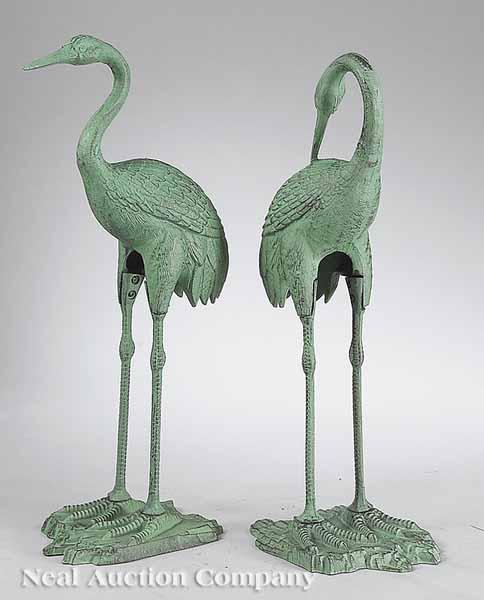 Appraisal: A Pair of Cast Iron Cranes th c one with