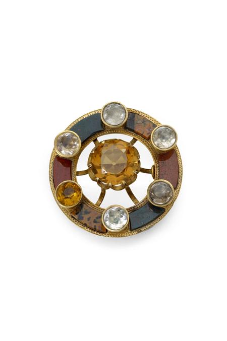 Appraisal: A gold mounted pebble brooch unmarked of circular outline with