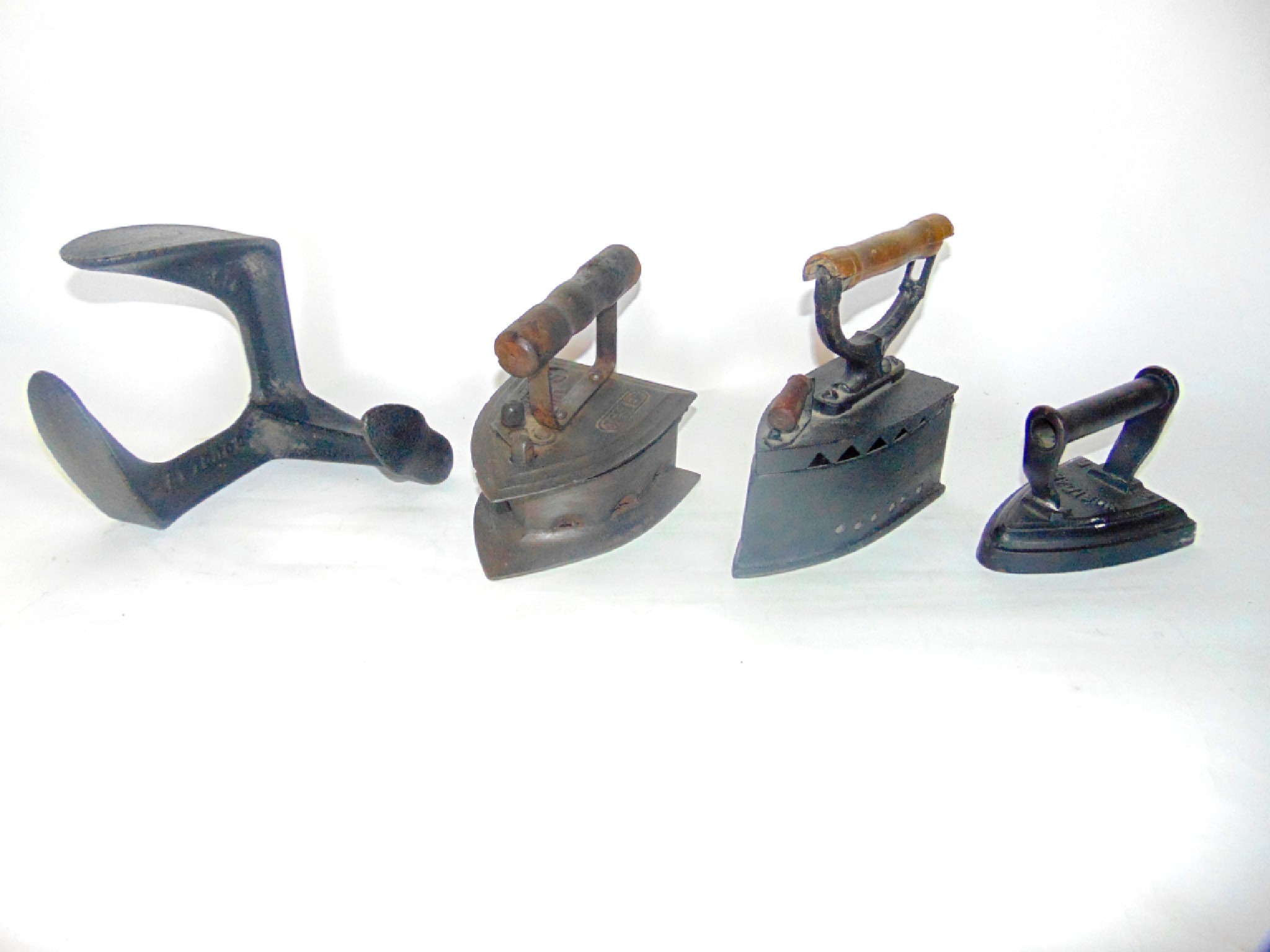 Appraisal: Three antique domestic irons together with a cast iron shoe