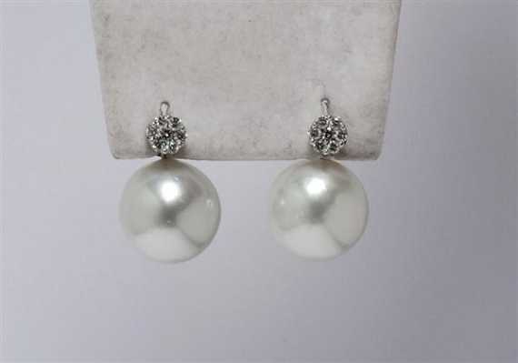 Appraisal: PEARL AND DIAMOND STUD EARRINGS White gold Decorative stud earrings