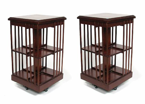 Appraisal: A pair of Edwardian style mahogany revolving bookshelves height in