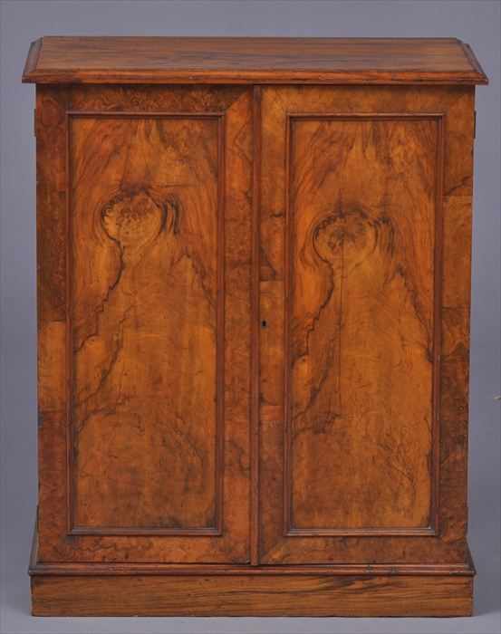 Appraisal: LATE REGENCY WALNUT COLLECTOR'S CABINET The walnut veneered top with