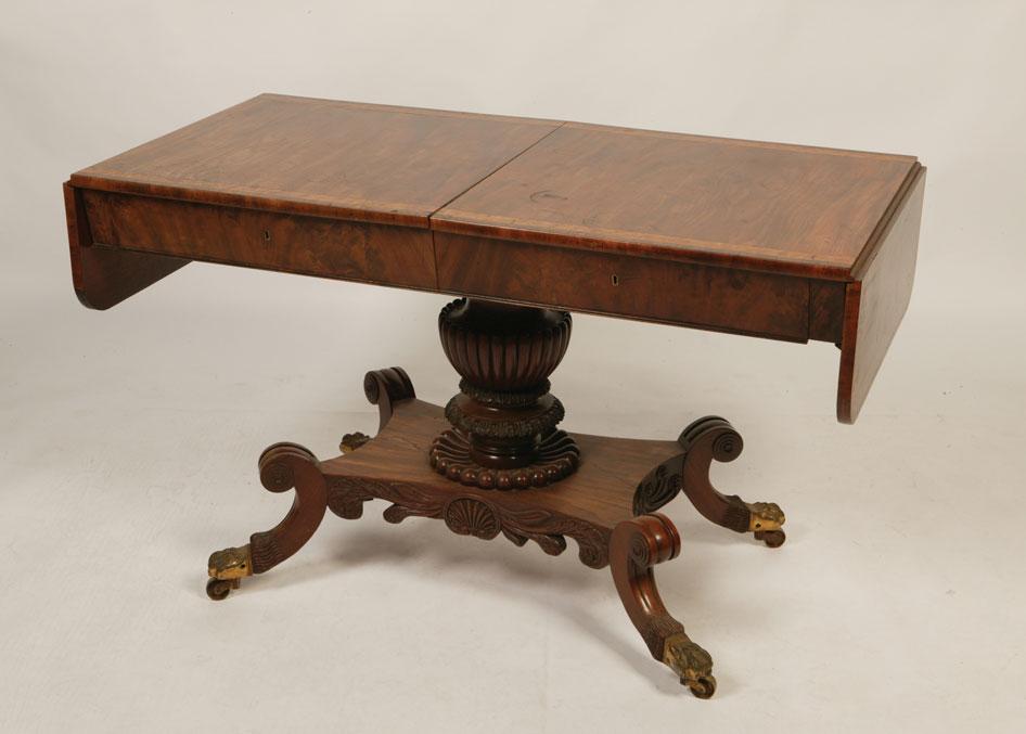 Appraisal: A REGENCY MAHOGANY SOFA TABLE the rectangular top with twin