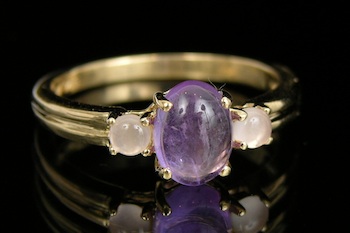 Appraisal: A Moonstone and Amethyst Cabochon Ring k white gold band