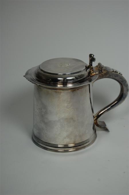 Appraisal: A large Edwardian Britannia standard lidded tankard by Goldsmiths Company