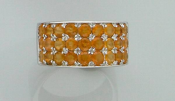 Appraisal: Fire Opal Band Ring Mexico A stylish ring mounted with