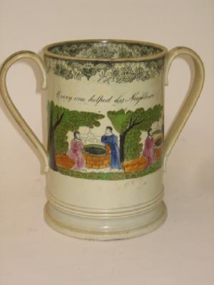 Appraisal: A LARGE STAFFORDSHIRE POTTERY LOVING CUP early th century painted