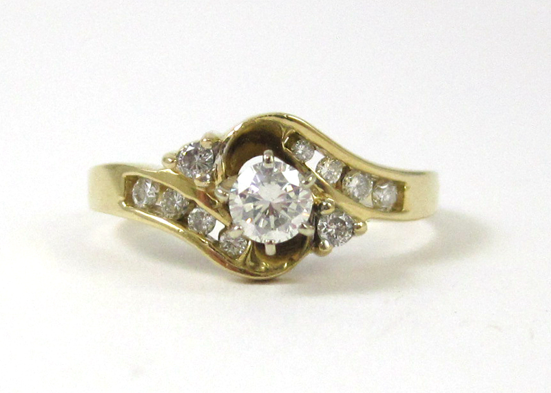 Appraisal: DIAMOND AND FOURTEEN KARAT GOLD RING with ten round-cut diamonds