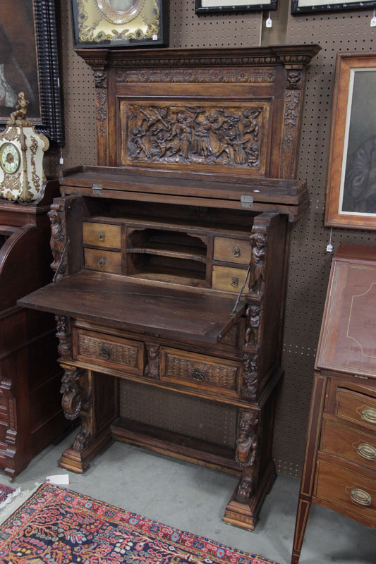 Appraisal: DROP FRONT DESK Extensively carved having a gallery and lift