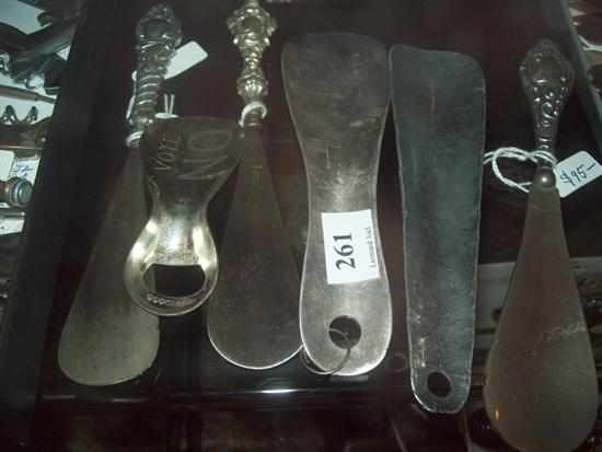 Appraisal: THREE VICTORIAN STERLING SILVER HANDLED SHOE HORNS AND THREE SILVER