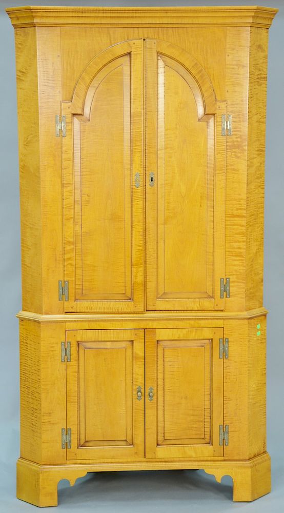 Appraisal: Eldred Wheeler tiger maple two part corner cupboard with two