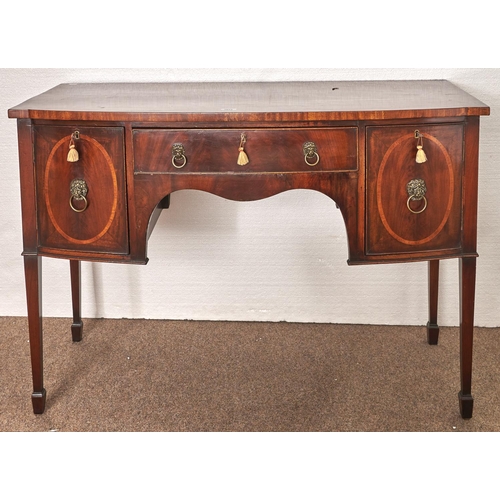 Appraisal: An Edwardian mahogany bow centred sideboard crossbanded in satinwood on