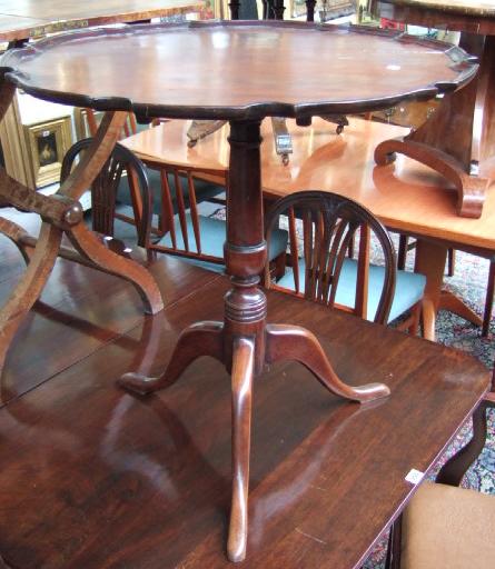 Appraisal: A George III mahogany snap top occasional table the scallop