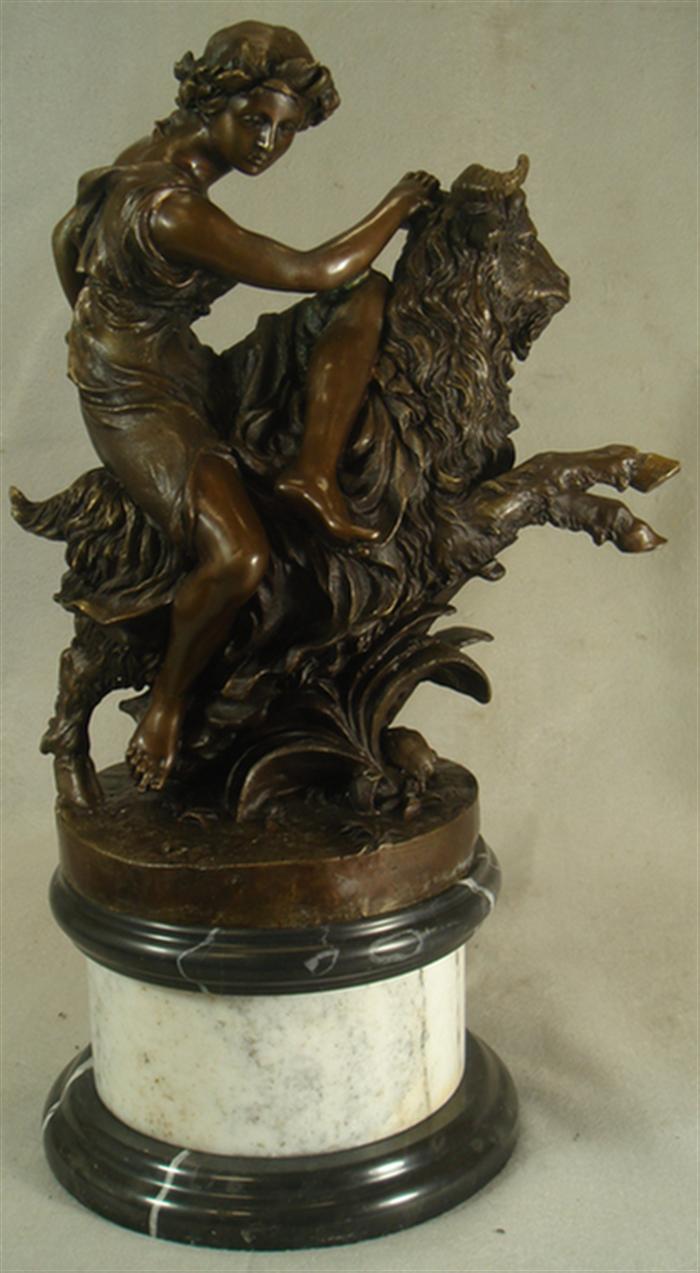 Appraisal: Bronze sculpture of a nude on a ram signed Claude