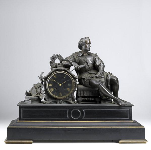 Appraisal: French marble and bronze figural clock th C Statue of