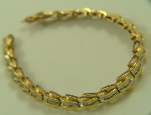 Appraisal: DIAMOND AND FOURTEEN KARAT GOLD BRACELET in length and set