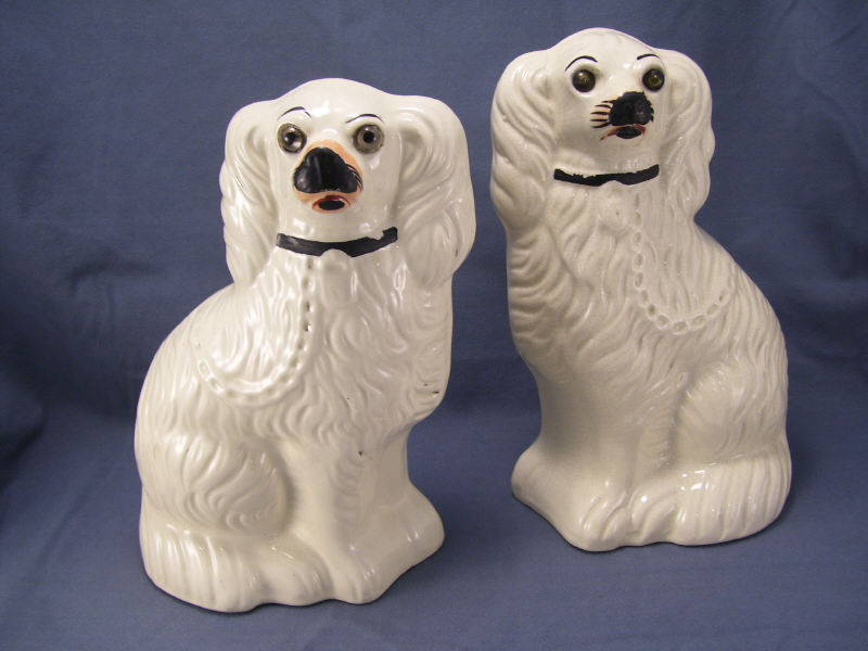 Appraisal: Pair Staffordshire Comforter Spaniels White spaniels glass eyes Measures high