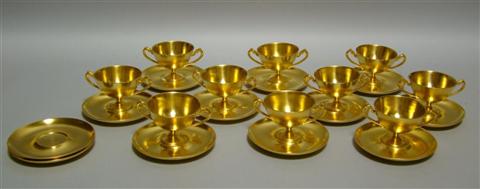 Appraisal: TEN GILT GERMAN BOULLION CUPS AND STANDS Each delicate coupe