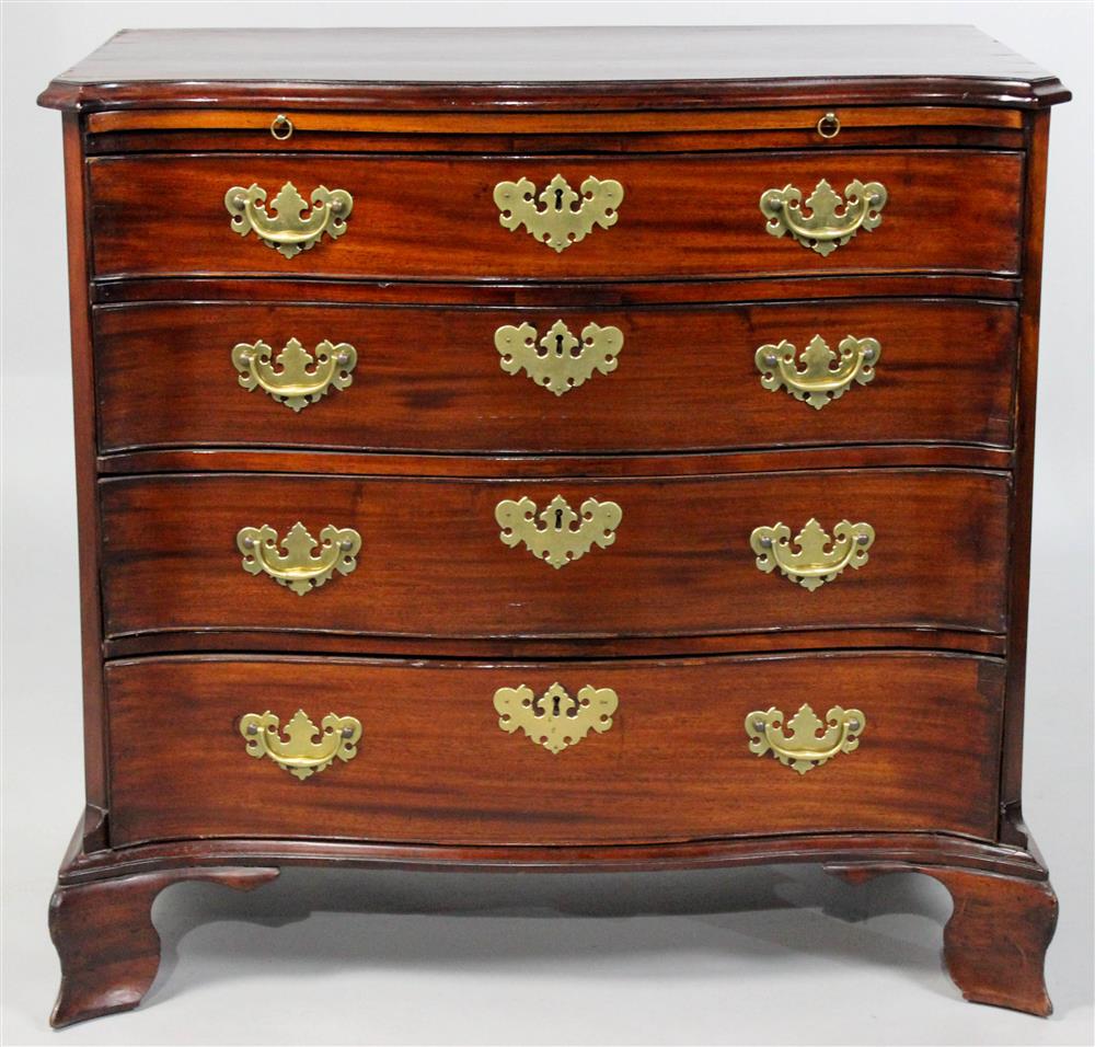 Appraisal: GEORGIAN MAHOGANY SERPENTINE FRONT BACHELOR'S CHEST the rectangular top with