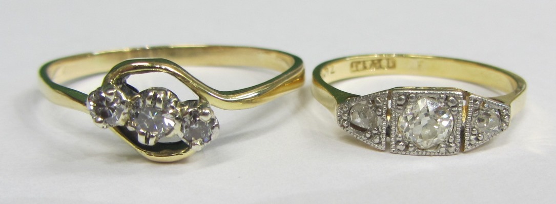 Appraisal: A gold and platinum diamond set three stone ring mounted