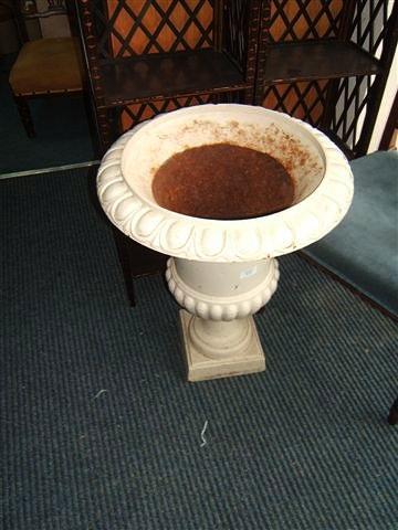 Appraisal: A pair of white painted cast iron urns of campana