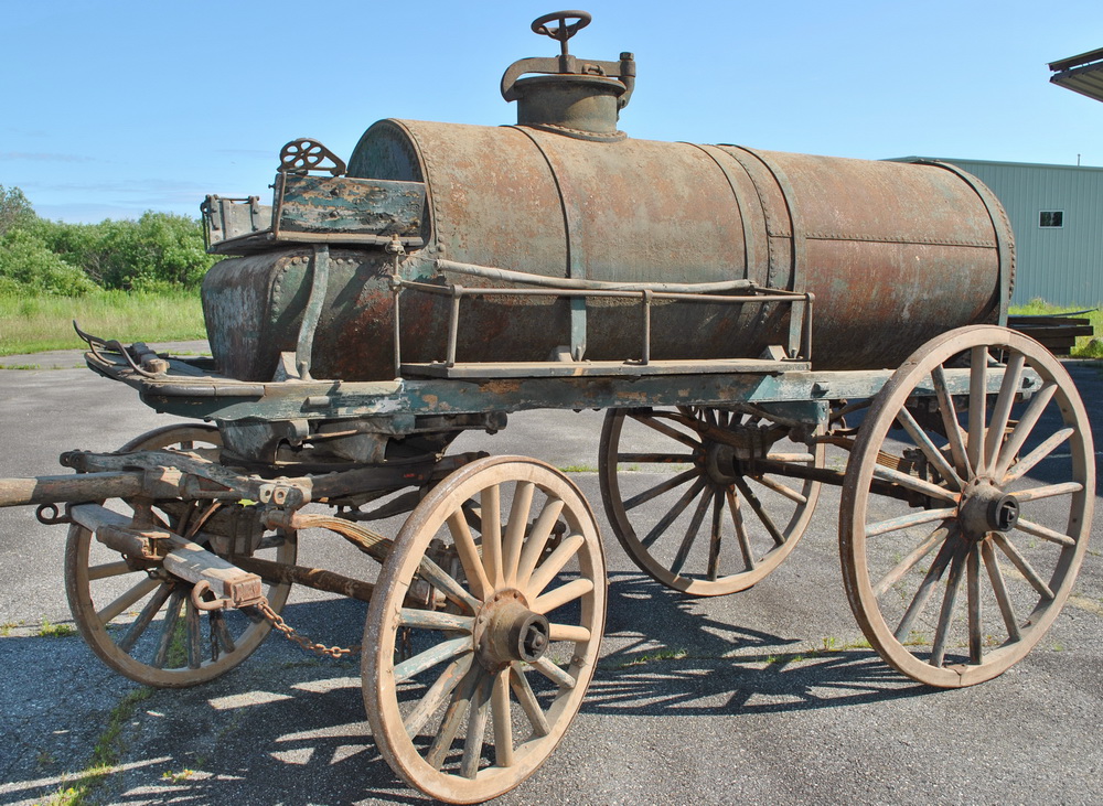 Appraisal: PETROLEUM TANK WAGON - Heavy single compartment riveted iron tank