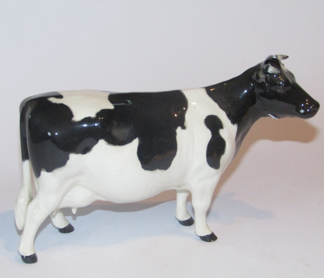 Appraisal: A Beswick pottery Friesian cow Claybury Leegwater printed marks beneath