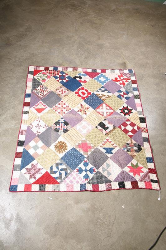 Appraisal: PIECED SAMPLER QUILT Maroon floral border with pinwheels plaids paisleys