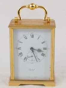 Appraisal: A brass eight day carriage clock with visible movement by