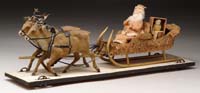 Appraisal: WHEELED-PLATFORM SANTA IN SLEIGH WITH REINDEER An early twentieth century