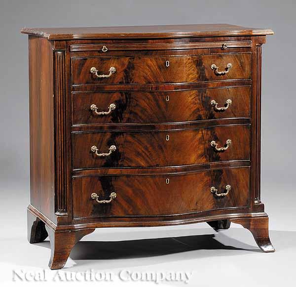 Appraisal: An Antique George III-Style Mahogany Serpentine Chest c the top