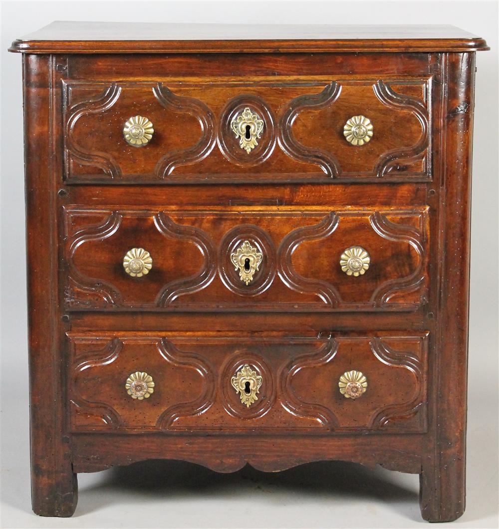 Appraisal: CARVED WALNUT FRENCH PROVINCIAL STYLE BACHELOR'S CHEST having a rectangular