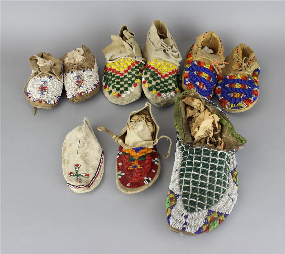 Appraisal: NINE NATIVE AMERICAN BEADED HIDE MOCCASINS three pairs and three