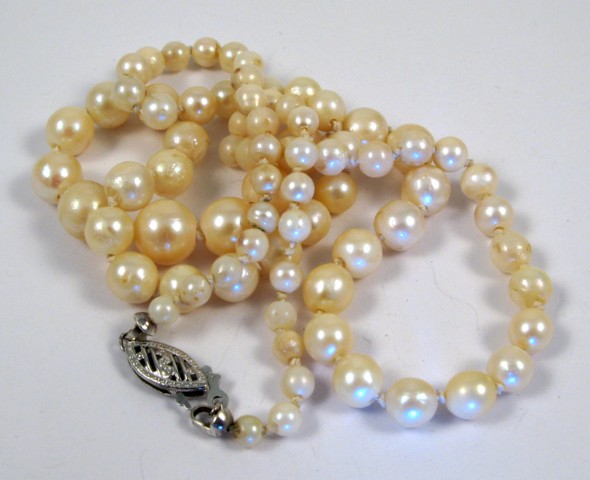 Appraisal: PEARL AND FOURTEEN KARAT GOLD NECKLACE - in length and