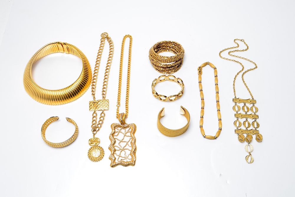 Appraisal: Gold-Tone Costume Jewelry Group Pieces Gold-tone metal woman's costume jewelry