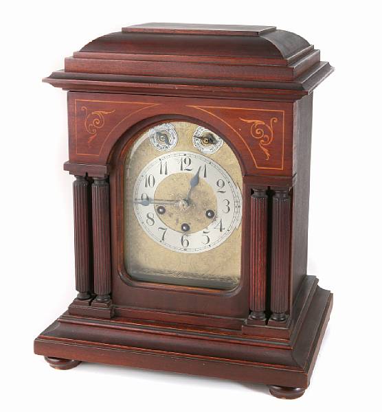 Appraisal: A German mahogany quarter chiming mantel clock height in width